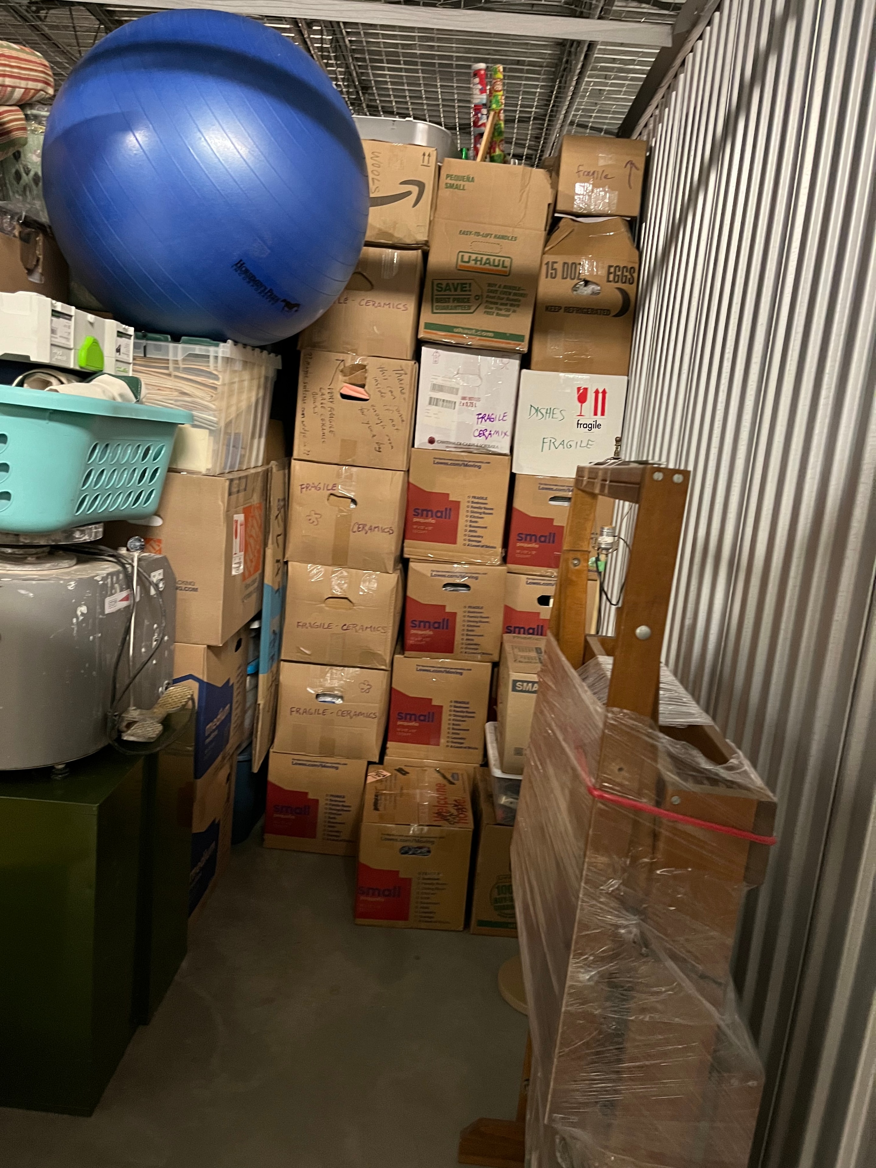 Movers carrying a sofa up apartment stairs