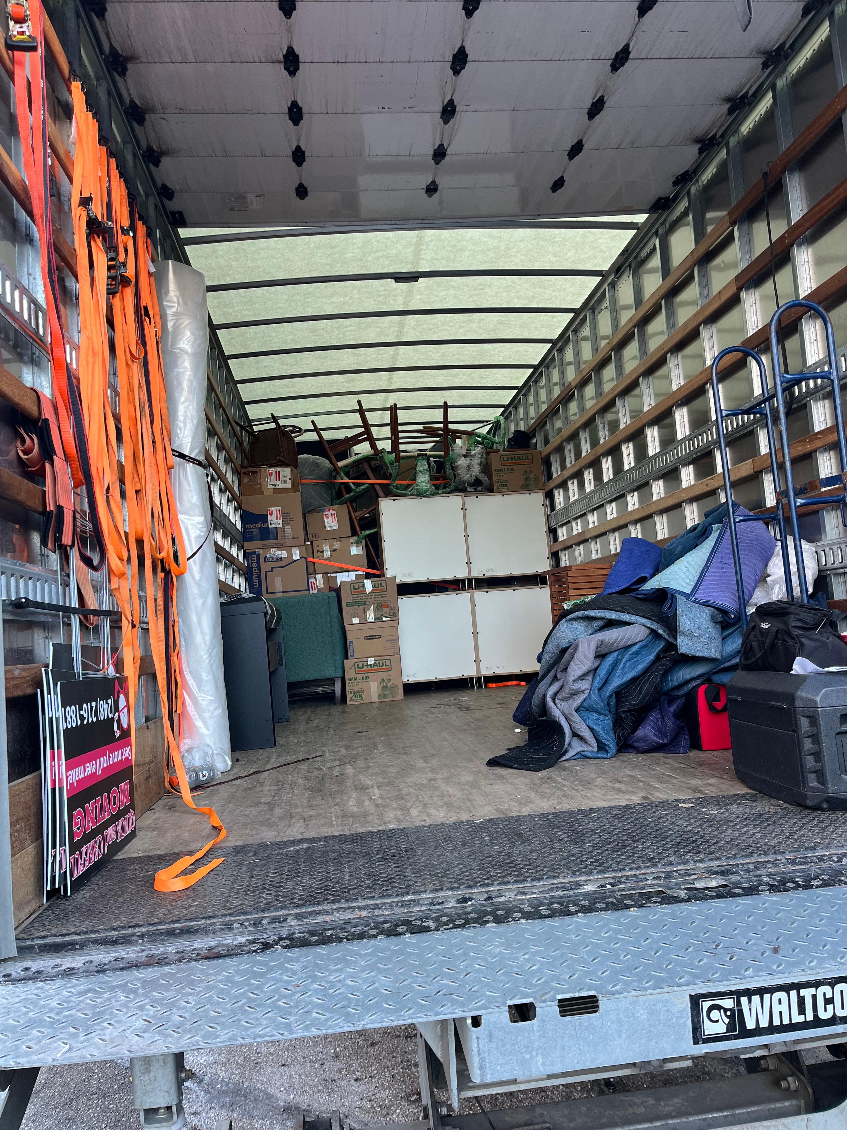 S&F Moving truck and crew on a residential job