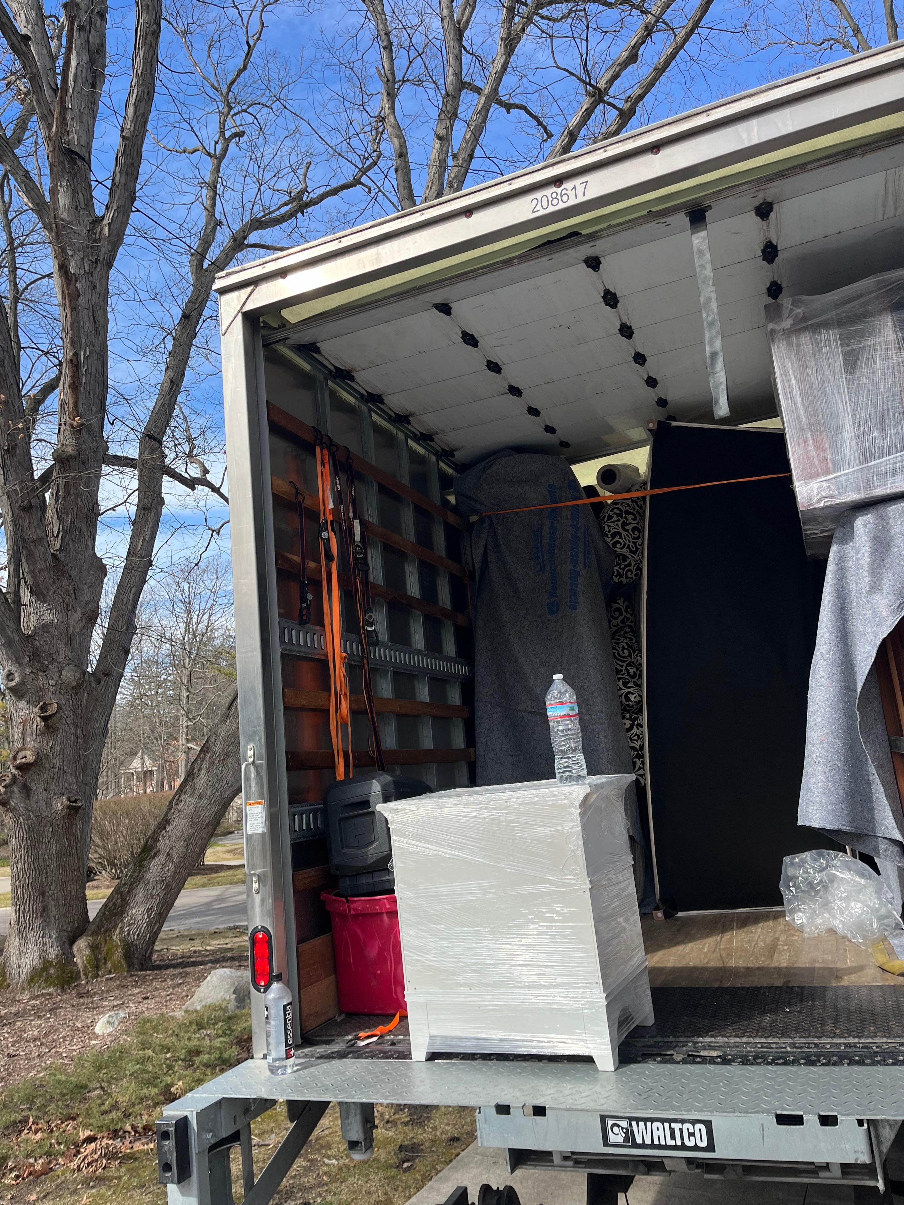 Movers loading furniture into truck