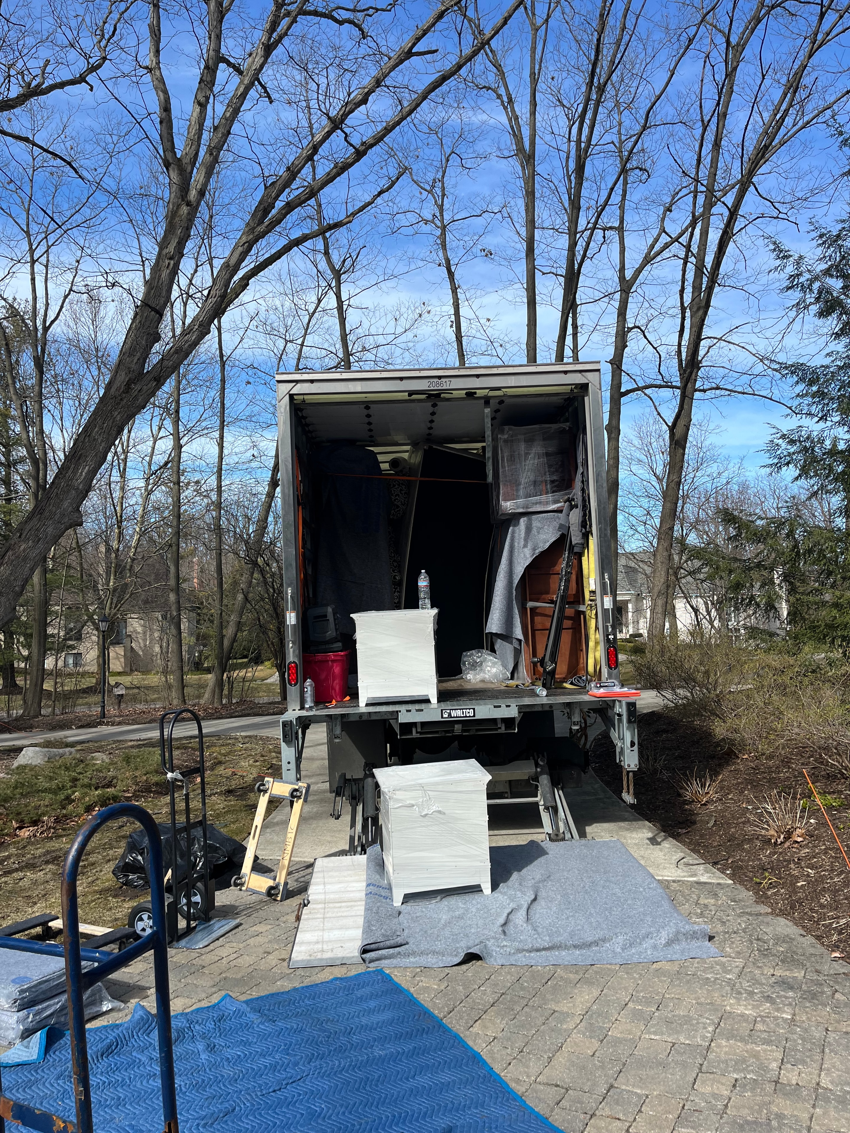 Moving crew carrying boxes